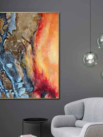 This hand-painted abstract art combines fiery oranges and reds with cool blues and textured gold foil. The contrast of colors and textures creates a powerful and captivating piece.