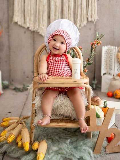 Celebrating a half-birthday in the cutest way possible! This little chef is marking six months with a fun, food-themed milestone session.