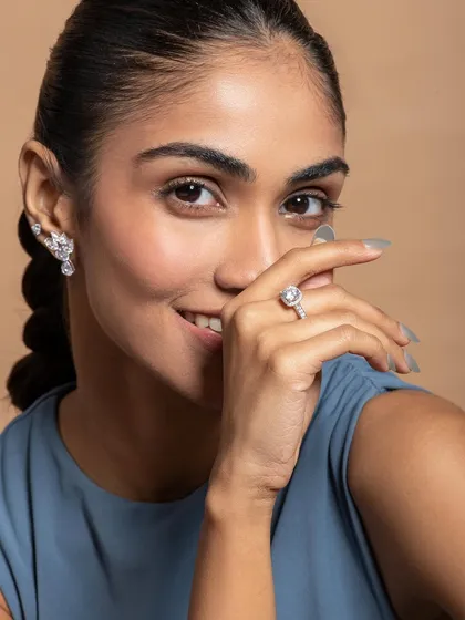 A joyful, commercial shot for Nipura Fashion. A smiling model makes the product feel accessible and aspirational, perfect for engagement or bridal jewellery.