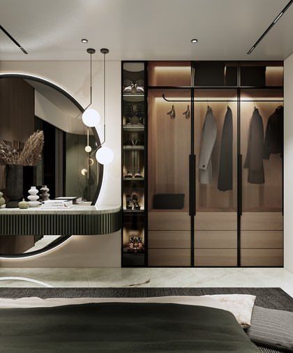 A look at the integrated dressing area in the modern bedroom, featuring a floating vanity, a large circular mirror, and open-shelf storage for a functional yet stylish space.