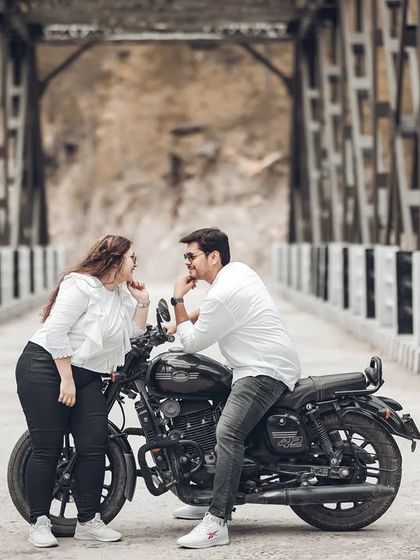 A sweet, interactive moment between the couple on the bridge. These small gestures of affection are what I love to capture during a shoot.
