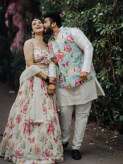 A playful and candid moment between the couple during their Haldi photoshoot.