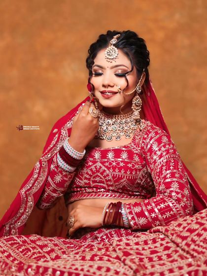 A beautiful close up showing the flawless makeup and the elegant simplicity of the bridal updo, allowing the stunning diamond necklace and earrings to shine.