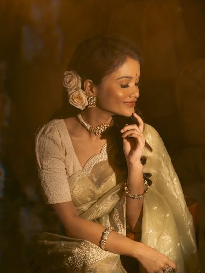 A serene, dreamy portrait of Sanjana. The choker and matching earrings add a touch of timeless grace.