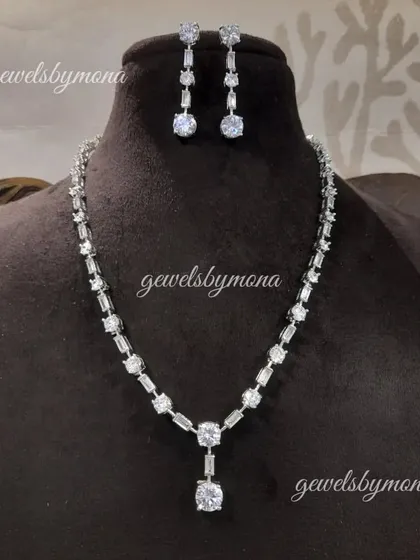 The complete diamond tennis necklace and earring set. This versatile and luxurious set can be worn for weddings, parties, or any event where you want to add a touch of sophisticated sparkle.