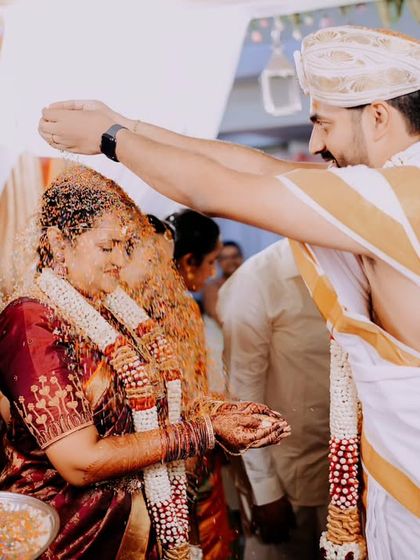 The Jeelakarra Bellam ceremony, where a paste of cumin and jaggery is placed on the couple's heads, symbolizes their inseparable union. This is a key moment we always capture.