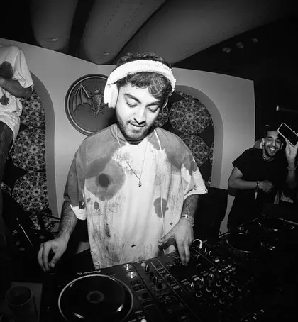 A black and white shot of me enjoying the moment at the Casa Bacardi party. The vibe was just right, and the crowd was with me on every track.