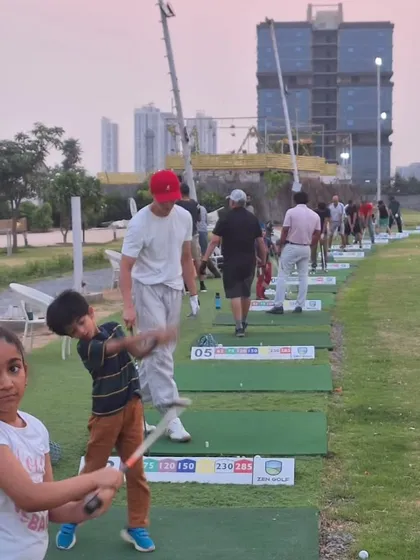 The range comes alive with players of all ages. Here you can see our youngest golfers practicing their swings alongside seasoned players.