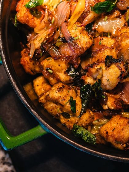 A close-up of a flavorful chicken dish prepared during our Malabar food festival. The rich spices, fresh herbs, and tender chicken pieces showcase the depth and complexity of Kerala's celebrated cuisine.