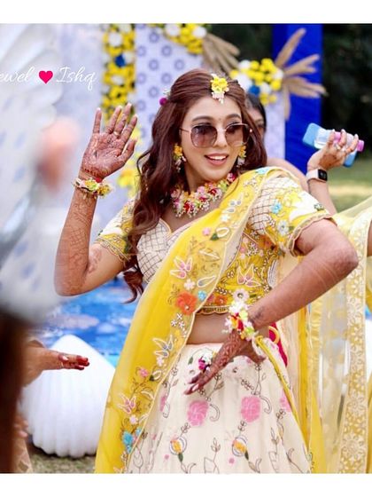 A duplicate of image 162, showing the bride's joyful dance at her Haldi.