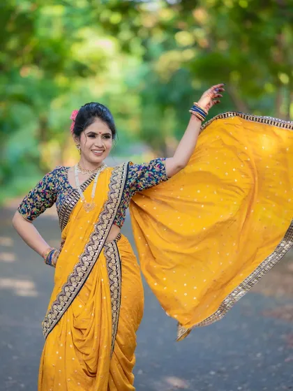 A confident and happy bride, her look is a perfect blend of contemporary charm and bold tradition.