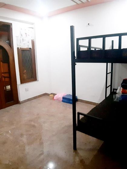 Another view of a room in the athlete hostel, showing the simple and functional living quarters provided for our residential trainees.