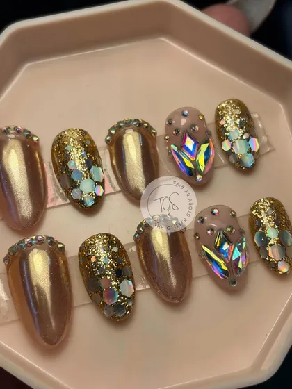 A complete, ready-to-ship bridal press-on set. This design features a mix of gold chrome, glitter, and hand-placed iridescent crystals, showing the variety of styles possible in a single set.