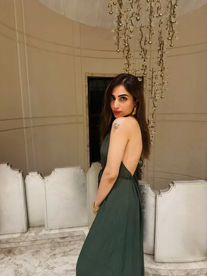 For a night out in Goa, I chose this elegant backless olive green maxi dress. It's a perfect example of a dress that's both glamorous and comfortable for a warm evening.
