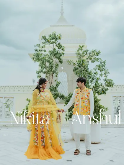 A beautiful couple portrait at their Haldi ceremony in Jaipur, with the stunning architecture of the Hyatt Regency in the background.