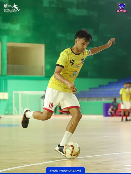 A player practicing his dribbling during the pre-match warm-up.