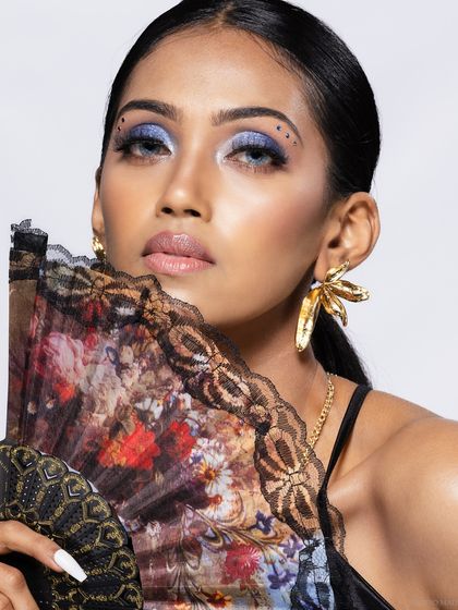 A beauty close-up from the fan series, highlighting the bold blue eyeshadow.