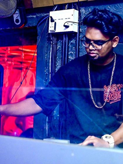 Adjusting the levels to get the perfect sound. Every detail matters when you're creating a vibe for a room full of people.