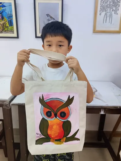 A large collection of our students with their finished paintings, showcasing a wide variety of subjects and styles.