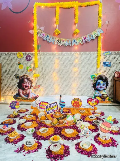 A wider view of the Krishna-themed setup, showing the 'Annaprashan' banner, fairy lights, and the complete floor arrangement. Every detail is designed to be both traditional and adorable.