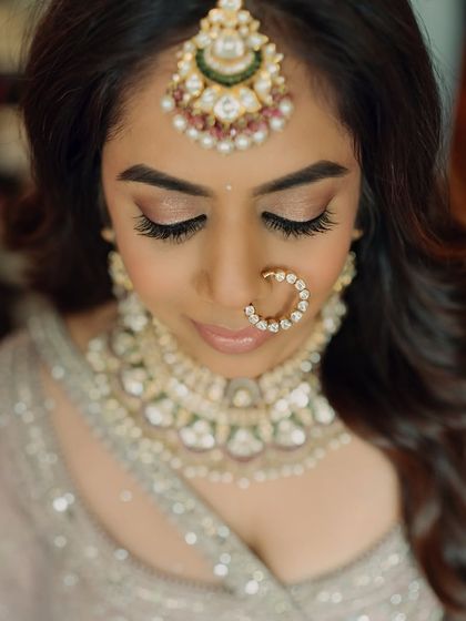 This portrait highlights the importance of detail in a minimal look, from the perfectly placed bindi to the subtle nose ring and flawless skin.