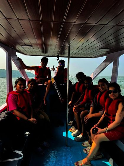 A silhouette shot of our group inside a boat during the Gokarna beach hopping tour.