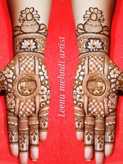 A traditional design featuring an elephant inside a central circle, with a kalash motif on the wrist.