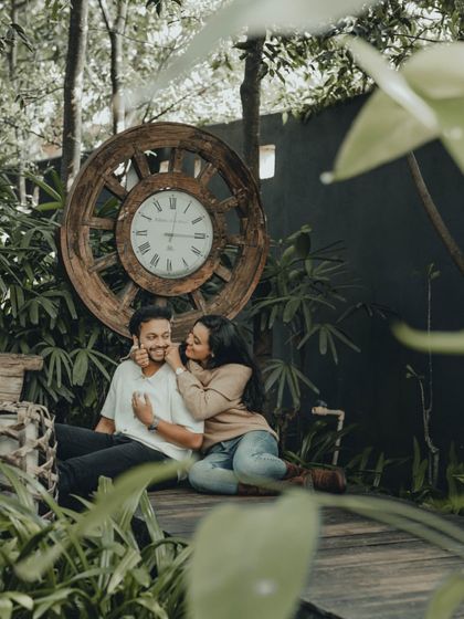 A playful and affectionate moment captured in a beautiful garden. My goal is to make you feel comfortable enough to just be yourselves.