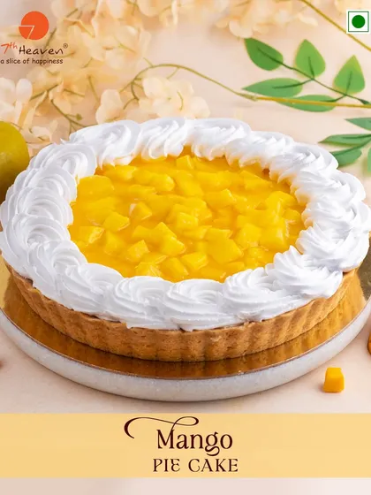 When life gives you mangoes, we make a Mango Pie Cake. This dessert features a buttery pie crust filled with fresh, juicy mango and topped with fluffy whipped cream.