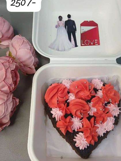 Another one of my heart-shaped bento cakes for Valentine's Day. This one is decorated with beautiful pink and red frosting rosettes, perfect for a romantic celebration.