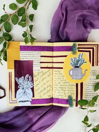 A purple-themed art journal spread using washi tape, magazine cutouts, and doodles, styled with a matching scarf.