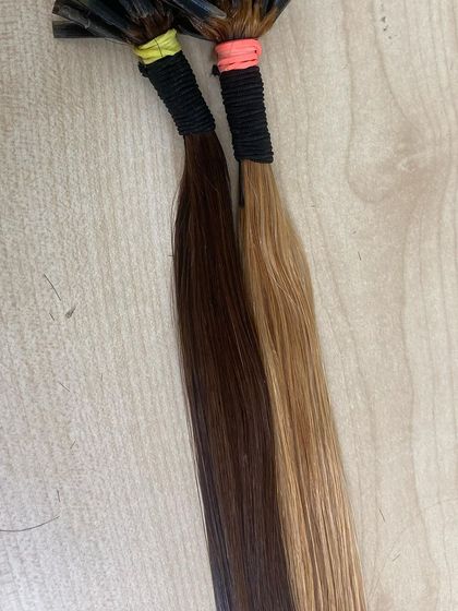 Two-toned I-Tip extensions, showing the variety of colors we offer for a customized look.