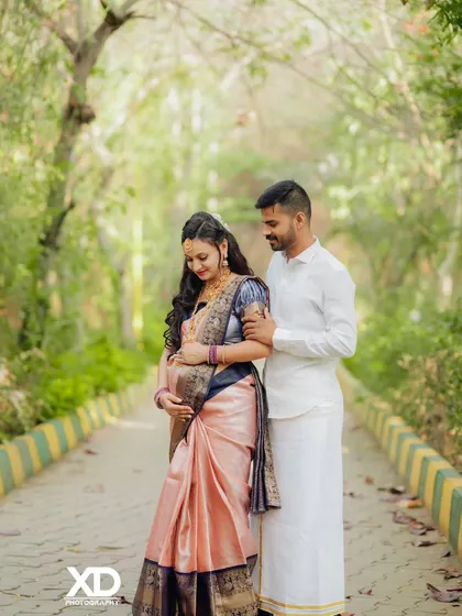 A gentle, loving gaze between the couple as they pose on a beautiful outdoor path.