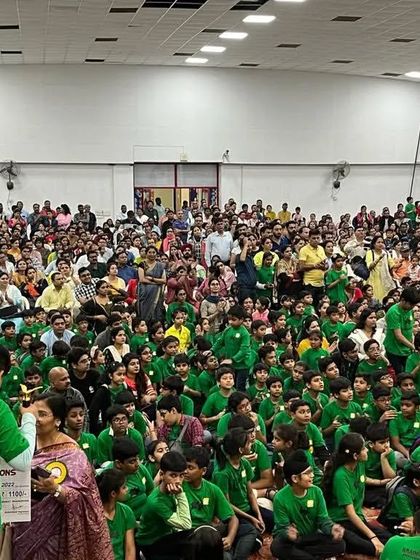 A wide shot of the audience and participants at the State Level Competition. The support from parents and the enthusiasm of the children create an unforgettable event.