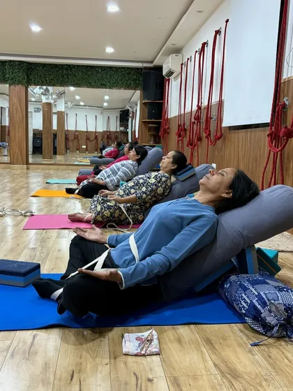 This is what deep relaxation looks like in our therapy yoga sessions. Using props like bolsters and blocks, we guide you into restorative poses that release tension, calm the nervous system, and allow your body to heal.