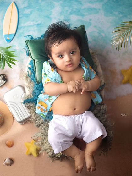 Just chilling out at the beach. This little guy is ready for some sun and sand in this adorable, summery baby photoshoot setup.