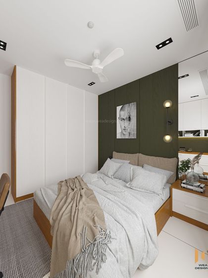 A full view of the bedroom, showing the white wardrobe and the dark green accent wall creating a balanced and modern aesthetic.