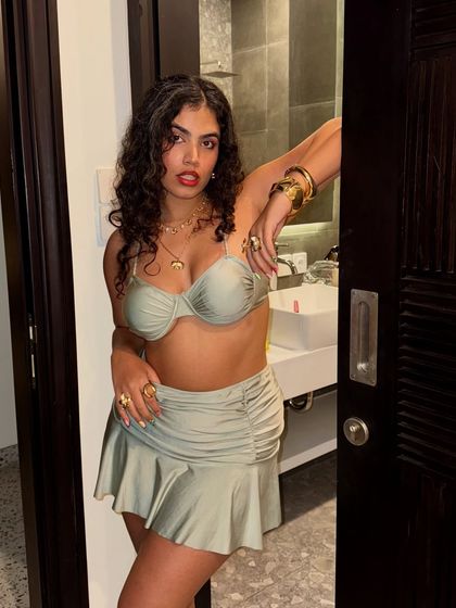 A confident pose in the doorway, ready to head out. This shot is all about that 'main character energy' before a big night.