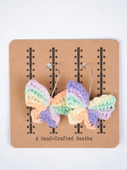 A clean product shot of the bestselling multi-color butterfly earrings. The colors are soft, dreamy, and go with so many outfits.