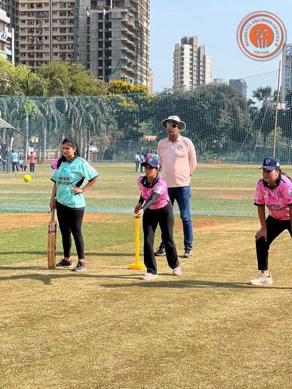 A batter gets ready to face a delivery during a women's PPL match. The image shows the mix of casual fun and focused competition that defines the league.