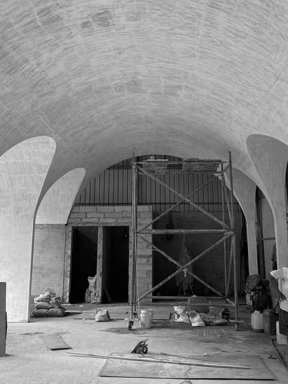 The interior of the "Vault's Up" project during construction. Even in its raw state, the interplay of light and shadow created by the vaulted ceiling is powerful and dramatic.