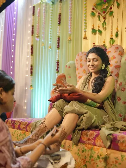 A candid moment during a bridal mehendi session. It's a long process, but we make sure the bride is comfortable and happy.