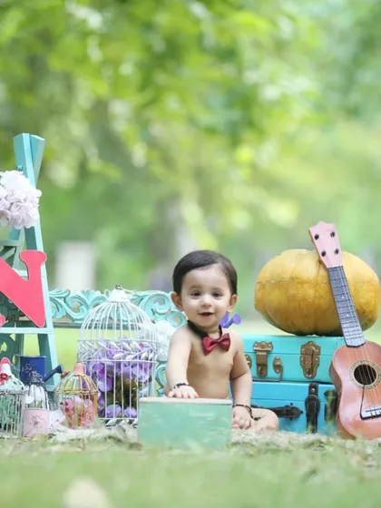 Every first birthday setup is unique. This one combines rustic and whimsical elements to create a rich, story-filled backdrop for the birthday boy.