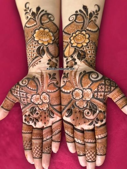 This Arabic-style bridal mehandi features bold floral and vine patterns that flow beautifully across the hands and arms, offering a modern yet elegant look.