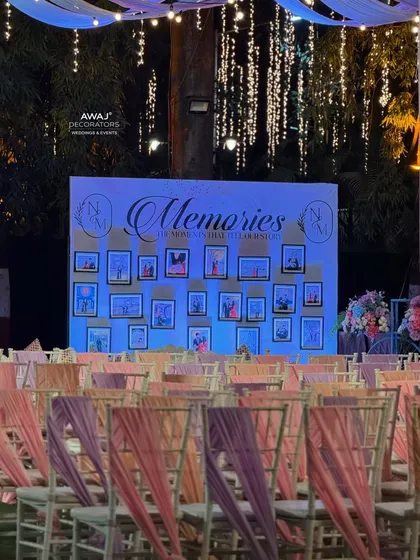 The memory wall lit up at night, with the photos glowing warmly.