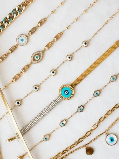 Another view of my evil eye bracelet collection. I love how the different styles and textures look together.