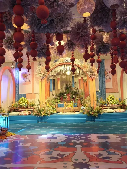 A complete view of our Moroccan Night Fall theme. The synergy between the rich blues and warm oranges, the custom-printed dance floor, and the detailed couple seating created a truly immersive and exotic experience.