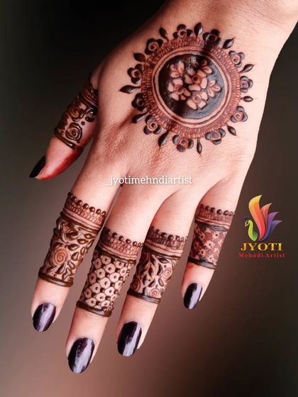 A beautiful back-of-hand design with a central mandala and detailed finger work. This is a classic minimalist style that is always in fashion.