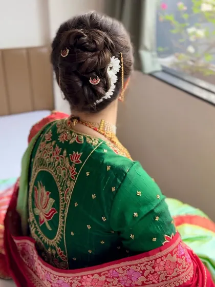 Another view of the elegant Maharashtrian bridal bun, a timeless and beautiful choice.