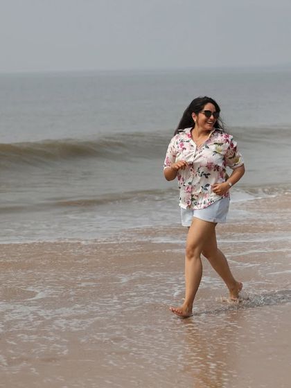 Capturing the fun and spontaneous moments is key to our candid style. Here, a couple playfully runs along the shoreline, resulting in a natural photograph filled with laughter and movement.